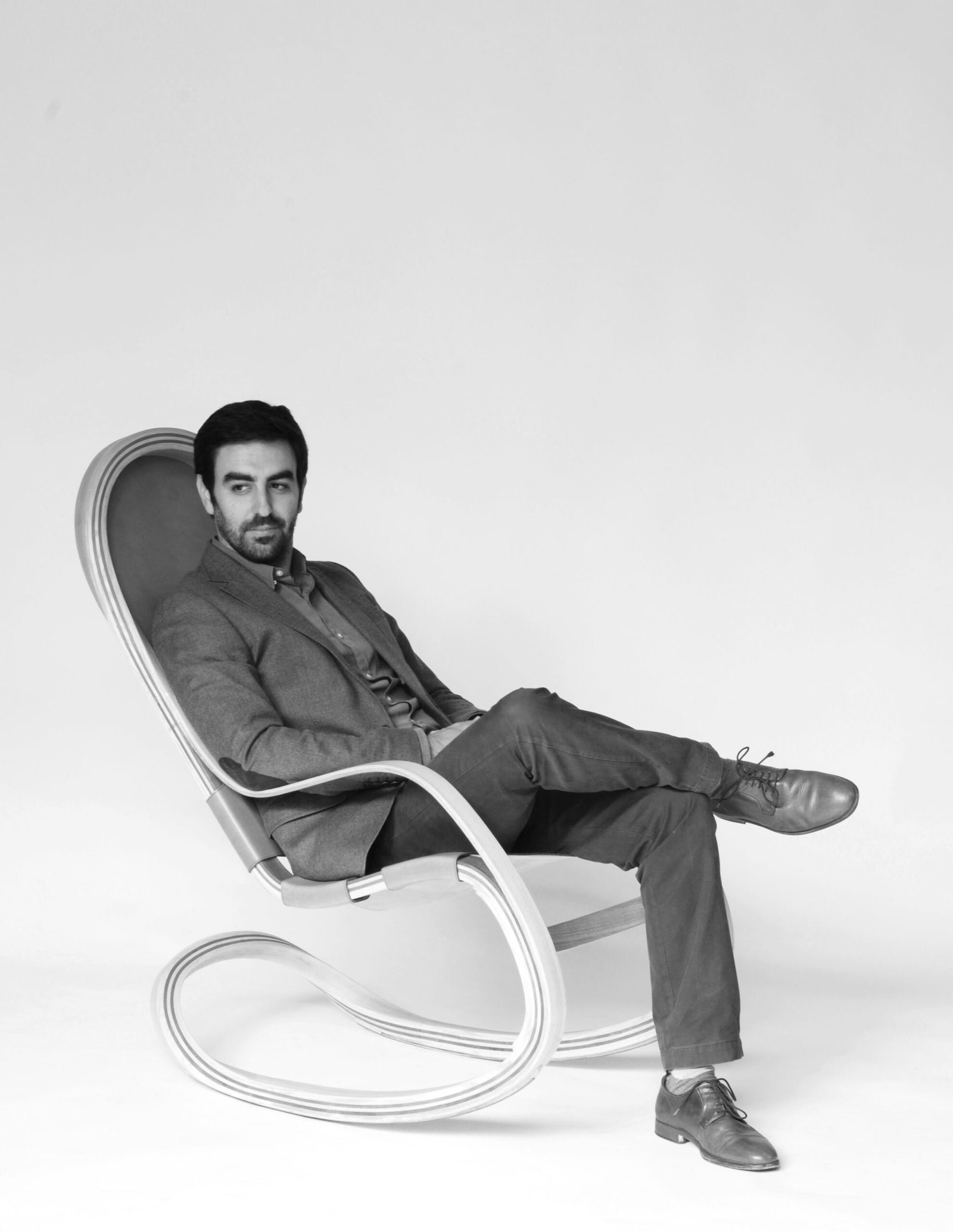 Andrés Mariño Maza seated in the Flect rocker, black and white portrait