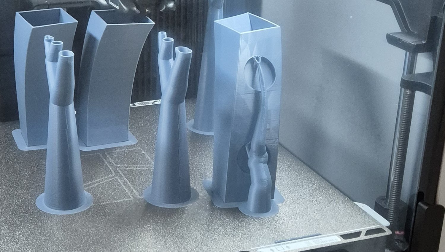 3D-printed jigs on the printer bed