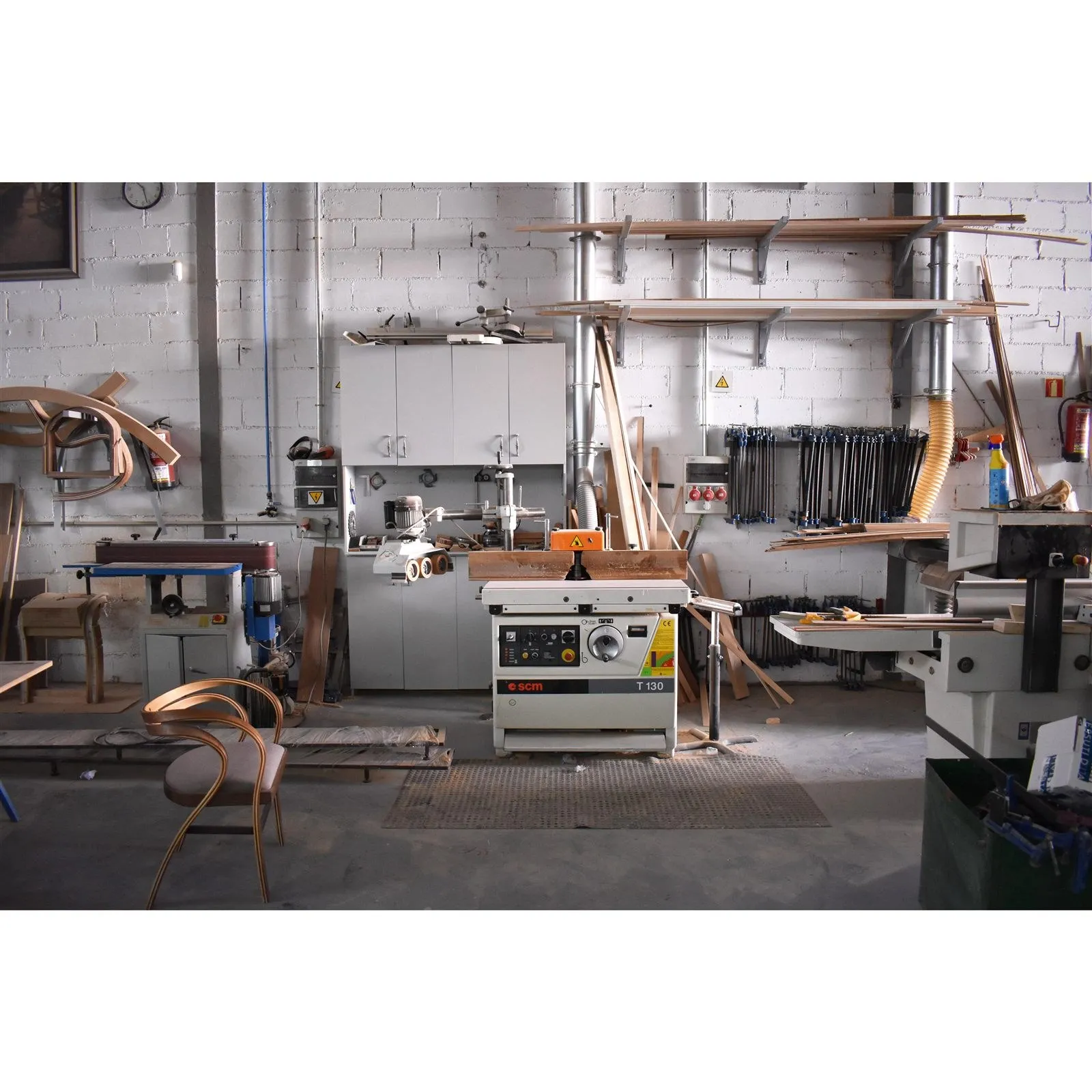 The workshop, with benches and wood stock