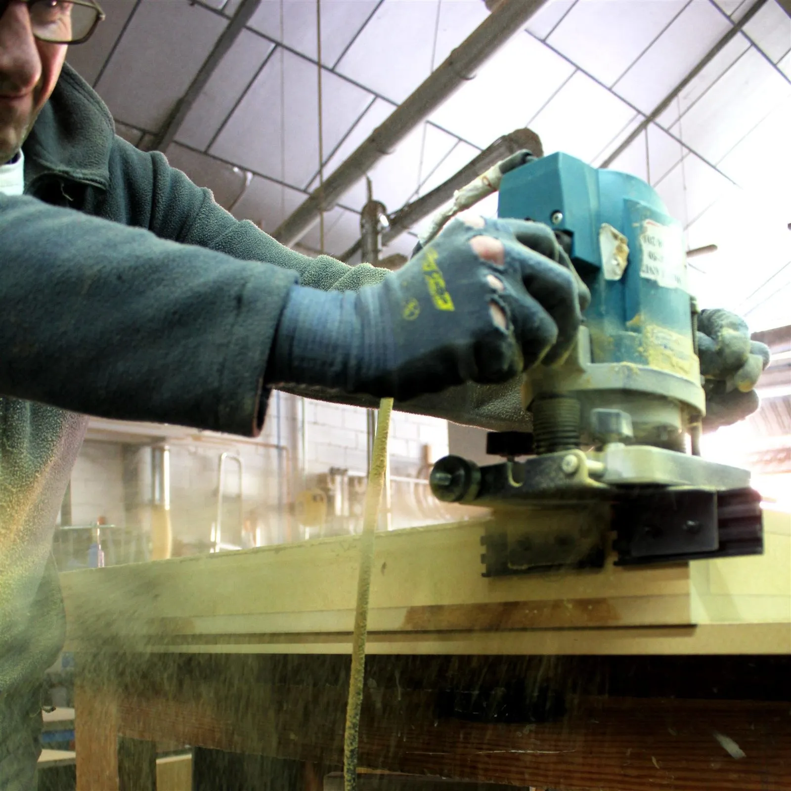Sanding a steam-bent part in the workshop